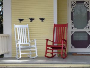 pair: red and white garden rocking chairs
